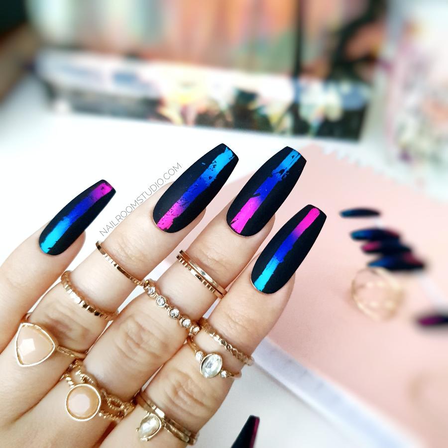 Black coffin nails in a matte finish, accented with chrome details in pink and blue by Nail Room Studio