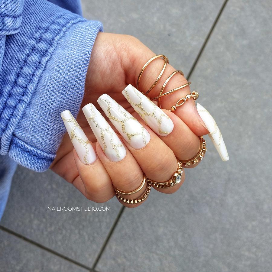 Nail Room Studio gold glitter marble nails on milky white base, ideal for creating a modern and elegant look, perfect for both hands and feet, matching manicure and pedicure options available