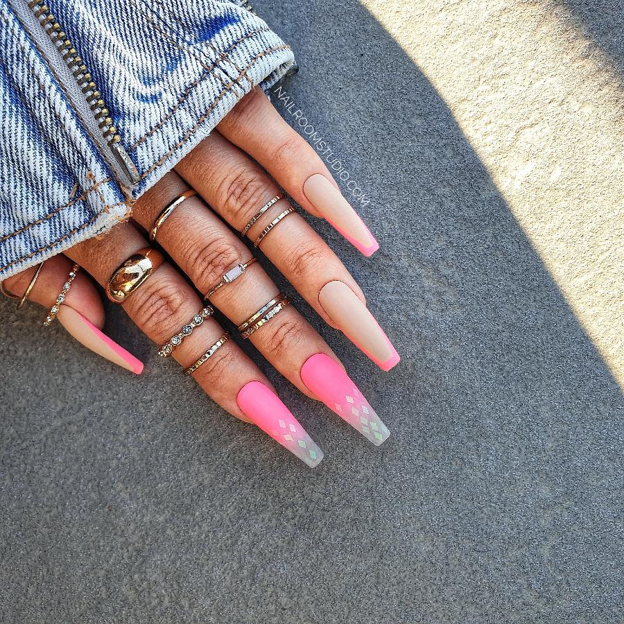 Pretty pink neon ombre nails with French design in long sculpted coffin, featuring a juicy, partially transparent tip, ideal for spring and summer by Nail Room Studio