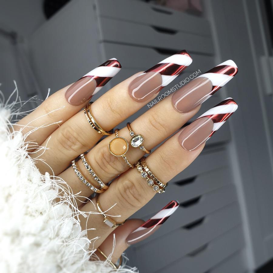 Candy Cane nails with natural dark beige and light brown, French design with white and red stripes, perfect for Christmas, winter, and matching hands and toes, ideal for darker skin tones by Nail Room Studio