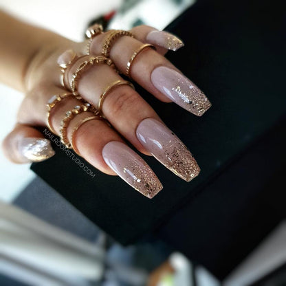 Nude ballerina nails with a subtle glitter ombre, perfect for bridal wear with a touch of elegance and sparkle