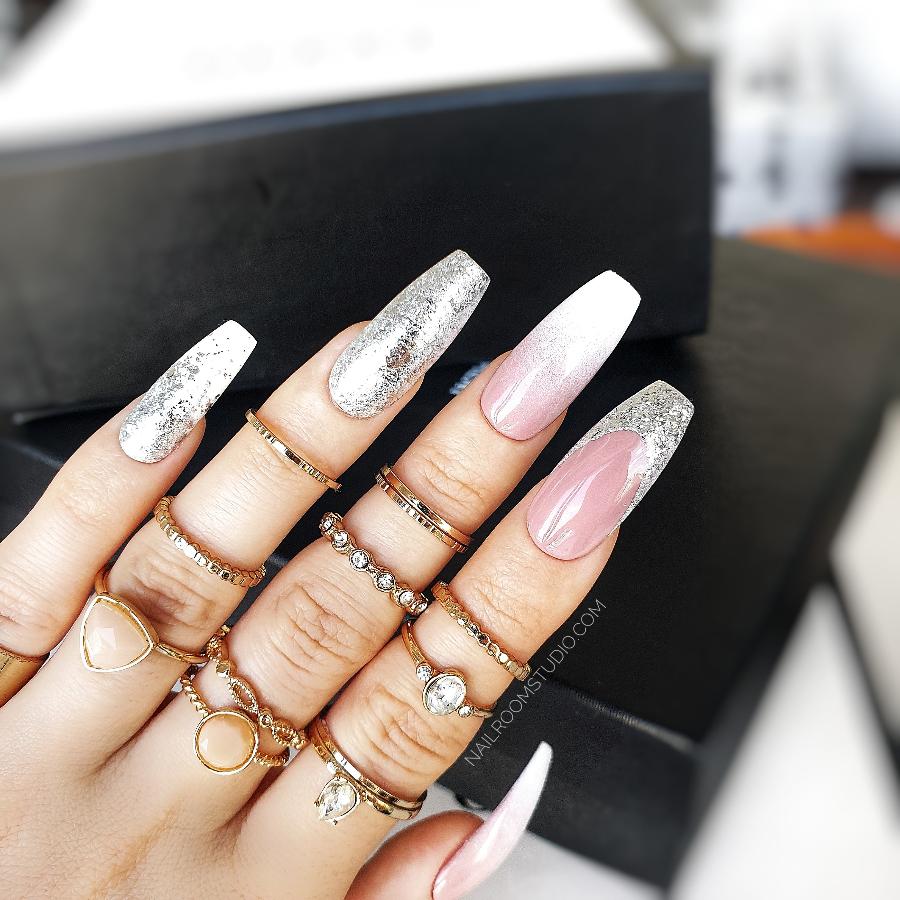 Beautiful nude nails with a Baby Boomer design enhanced by silver chrome for a sophisticated bridal look