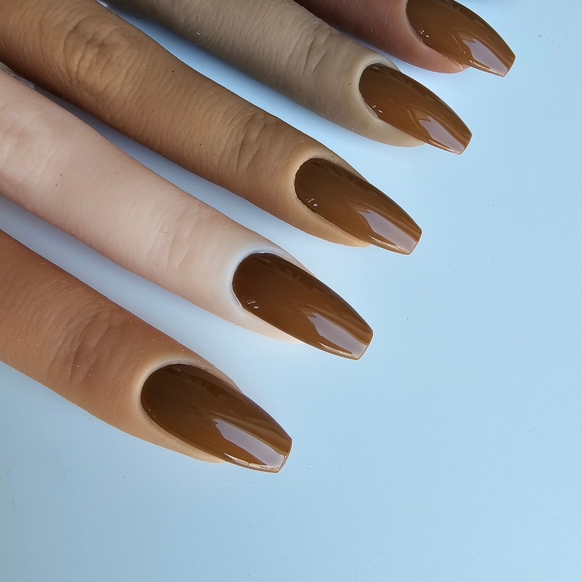 Intensely opaque brown-beige press-on nails, a rich, slightly pastel hue for a unique, standout look