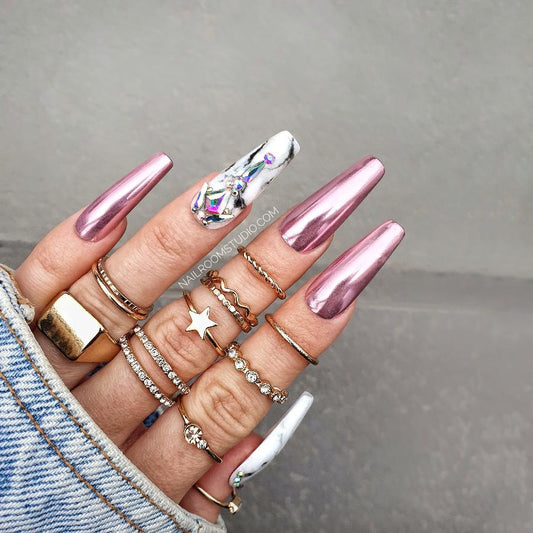 Romantic and extravagant chrome nails, crafted in a femme fatale style for a glamorous and feminine aesthetic