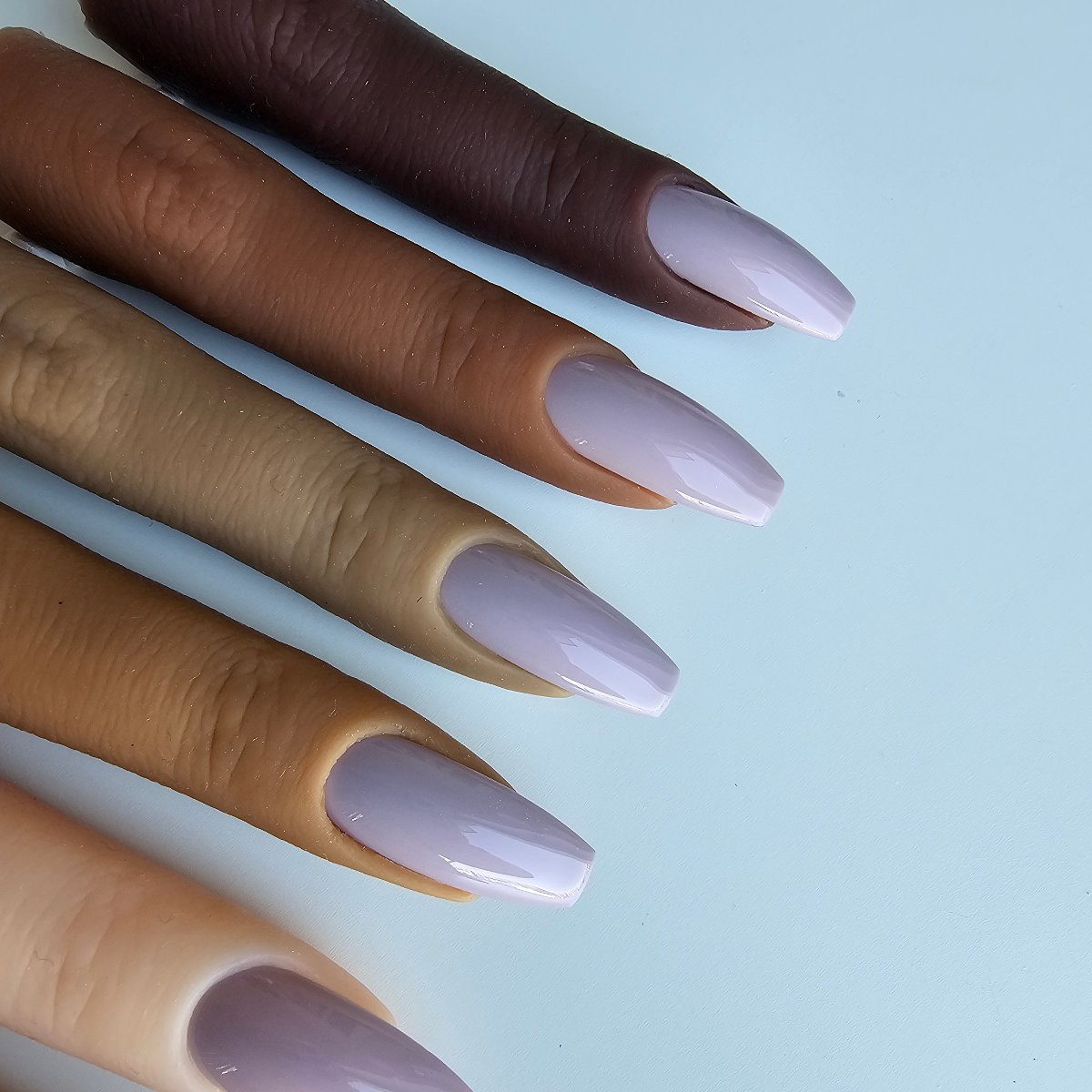 Elegant nude artificial nails, a soft, cool hue that’s ideal as a foundation for French manicures and color swatches for many skin tones, review and nail samples