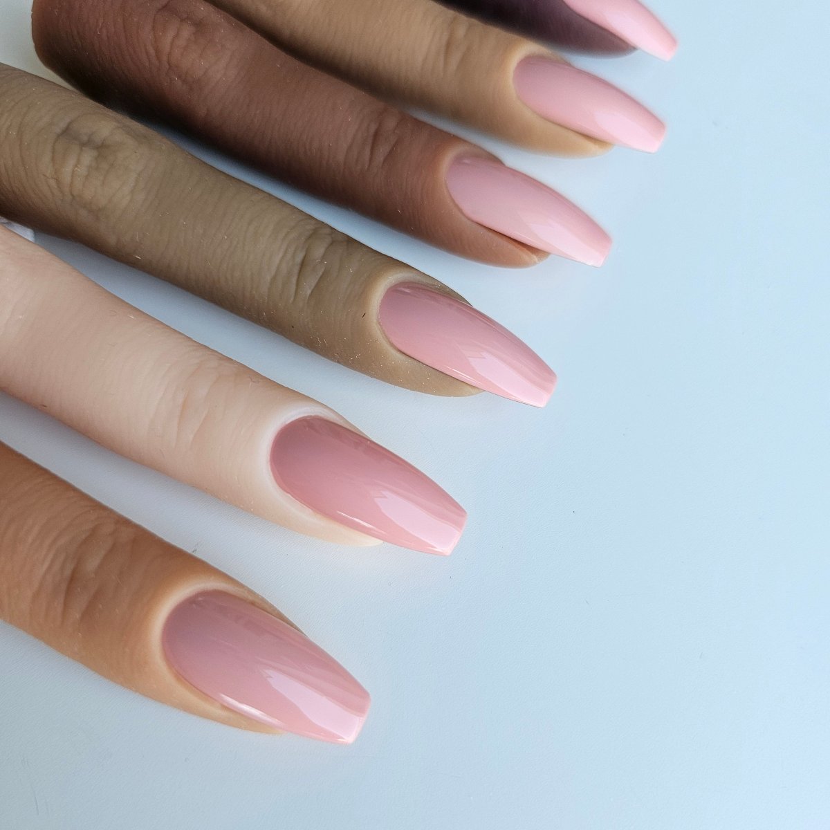 Delicate pastel pink PressOn nails with a powdery finish, providing a natural yet stylish appearance