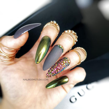 Fierce dragon nails with dark chrome and matte accents embellished with Swarovski crystals for a bold statement