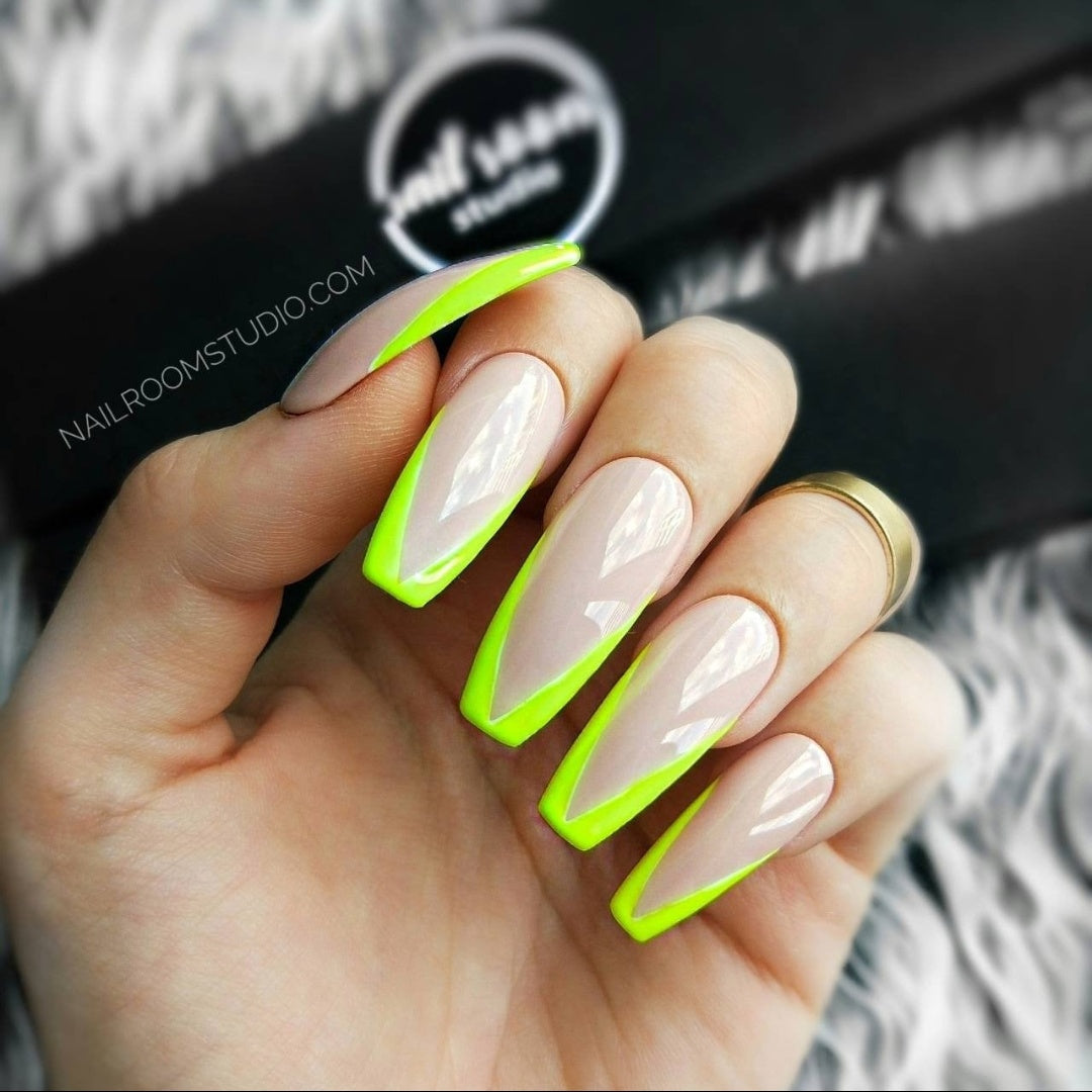 Stylish coffin-shaped press on nails available in various styles, featuring a bright nude color with a modern neon yellow French tip for a sunny look