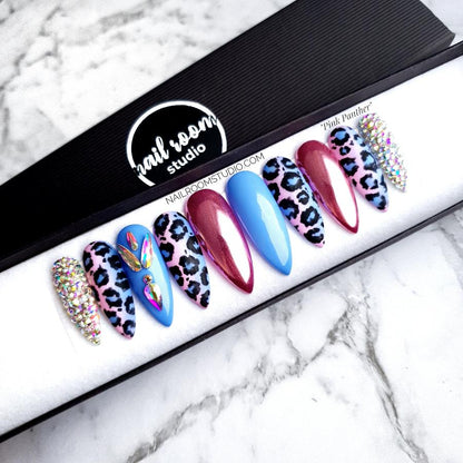 Exclusive boxed set of pink and blue ombre nails with panther print and iridescent Swarovski crystals, perfect for a stylish gender reveal