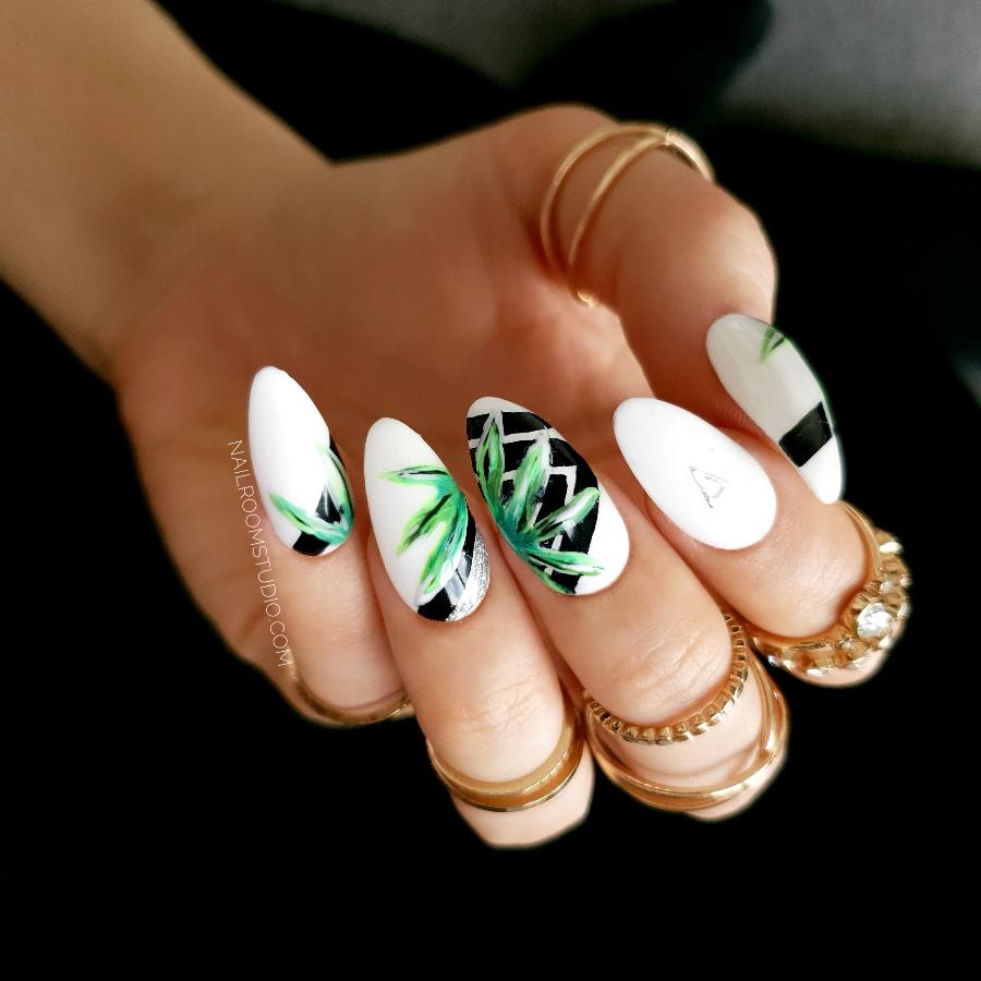 Exclusive set of white nails with black geometric and green botanical jungle-inspired details, presented in an elegant black box ready for shipping