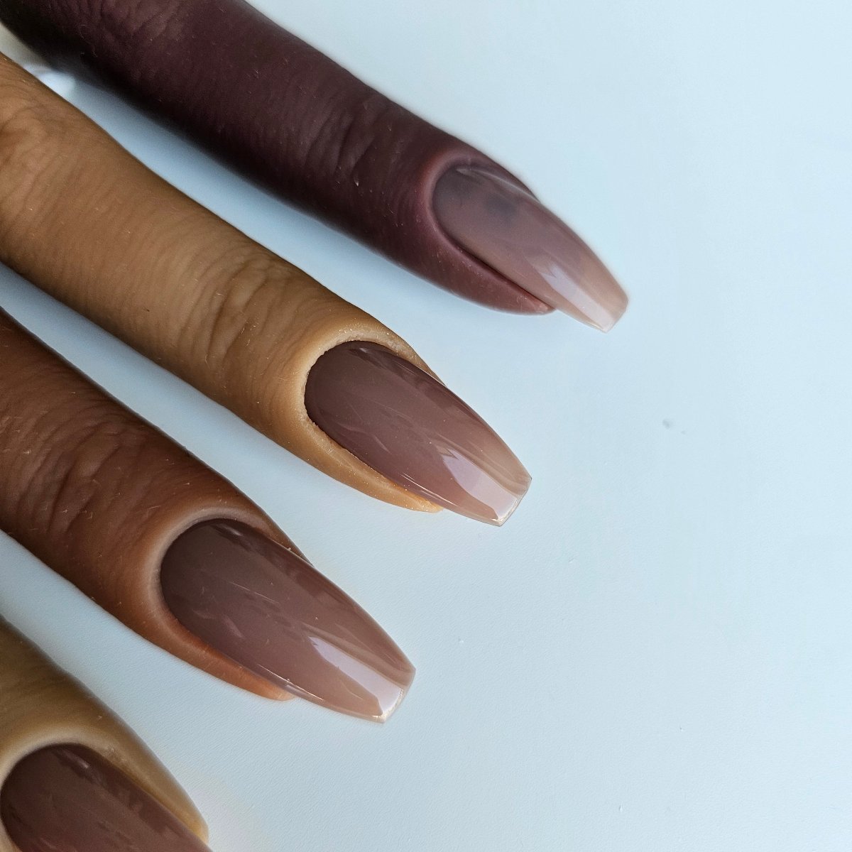 Soft brown PressOn nails with a natural, translucent finish, great for darker complexions in French manicures