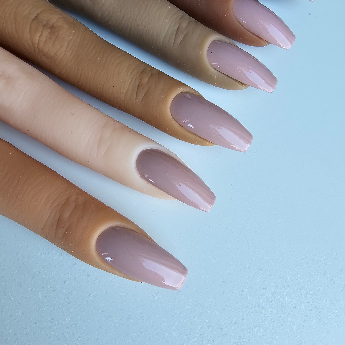 Subtle light lilac-blue press-on nails in a soft pastel shade, giving a gentle and elegant vibe