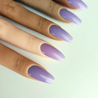 Light purple, witchy press-on nails with a unique, partially transparent purple shade, adding a mystical, trendy touch