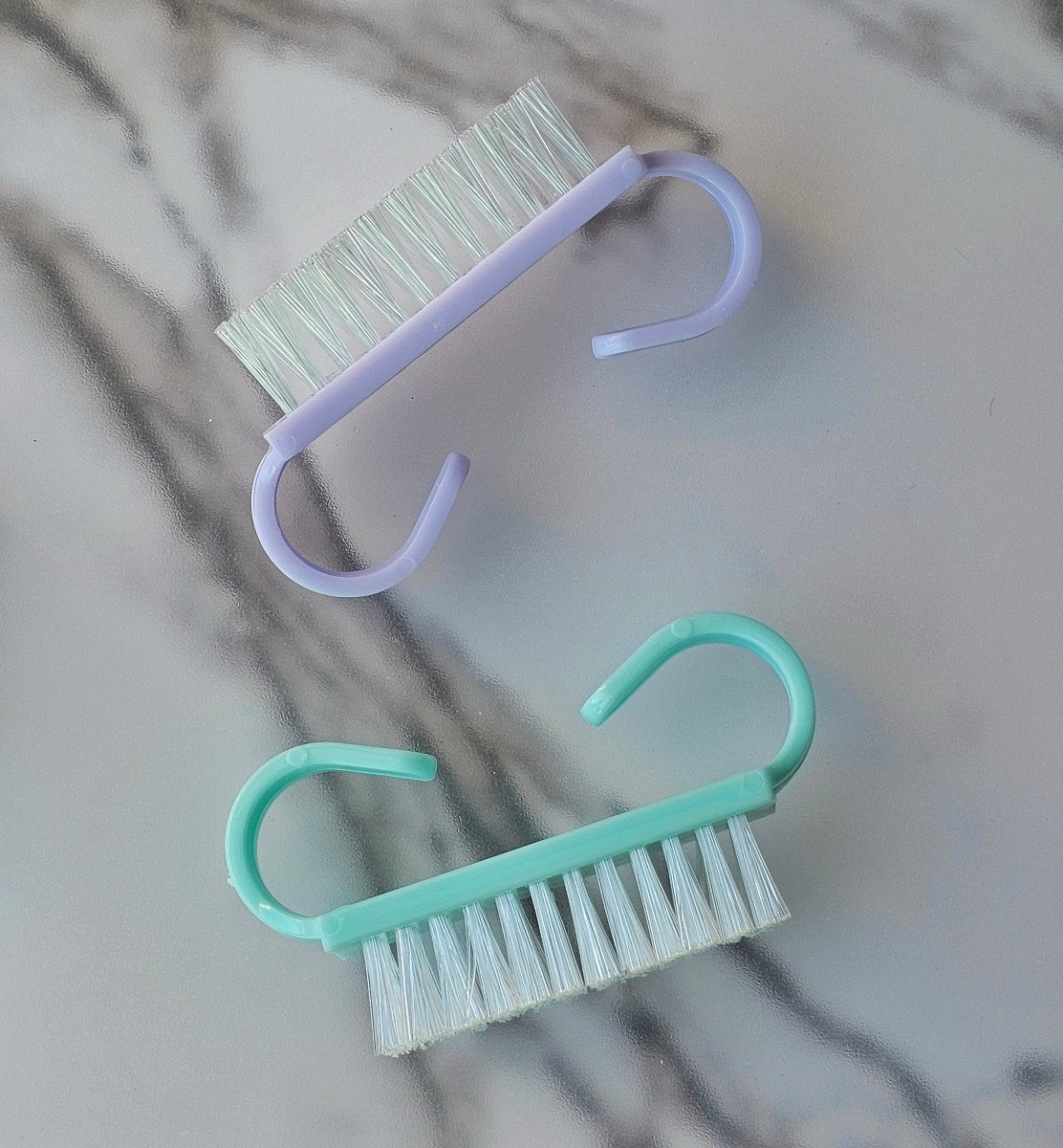 Mini lilac nail cleaning brush, perfect for prepping nails before Press-On application