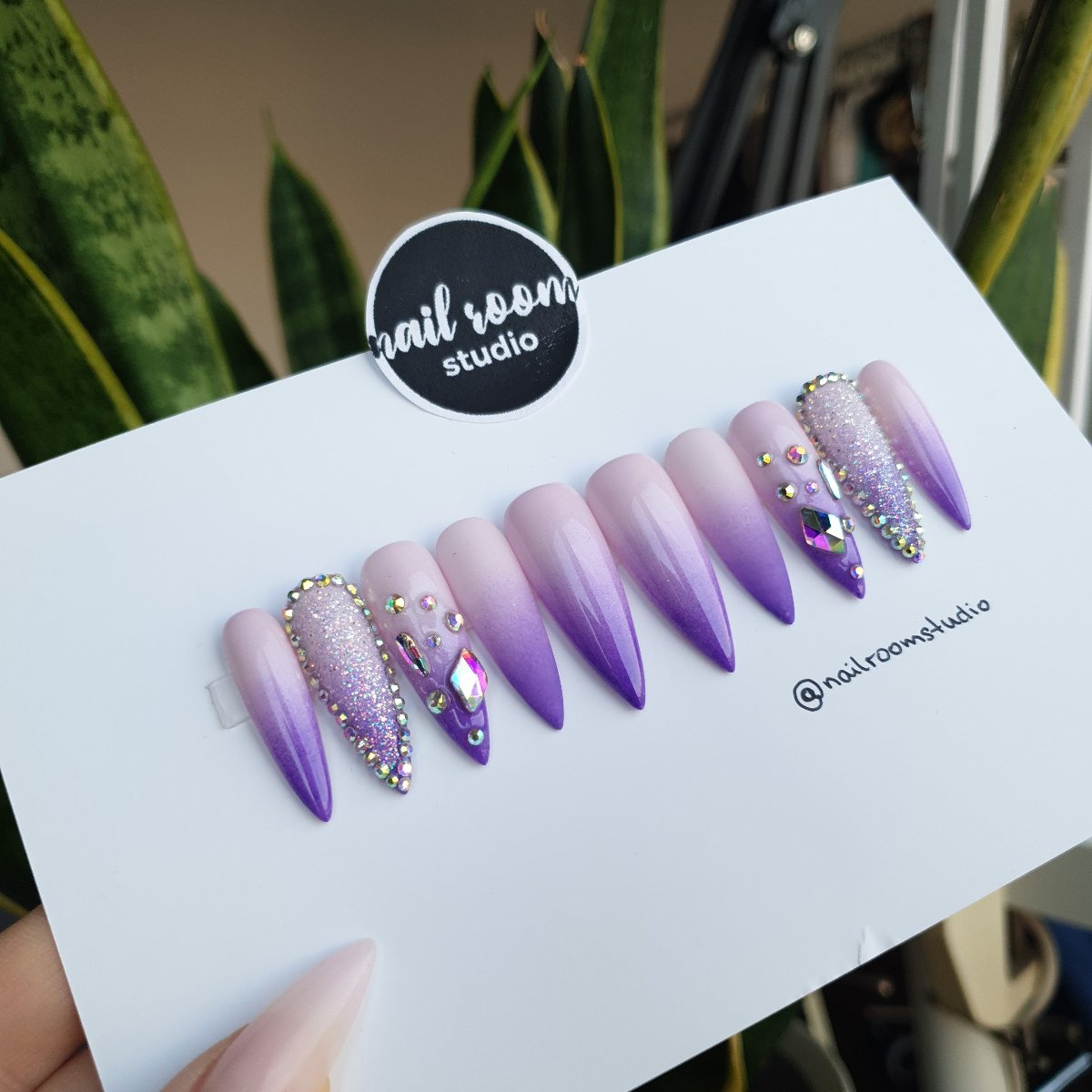 Beautiful lilac and purple ombre press on nails adorned with sparkling crystals, designed in a range of sharp styles for a striking look