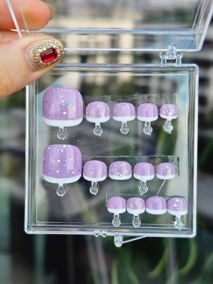 Sparkling lilac French PressOn toes with silver holographic glitter, square shape, packaged in a clear box