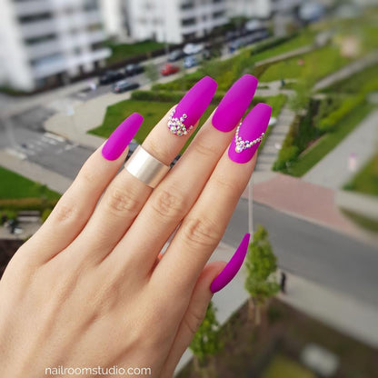 Stunning matte vibrant neon purple press-on nails featuring opalescent Swarovski crystals in a beautiful design. Long nails available in multiple lengths, sizes, and shapes, with shipping to the USA