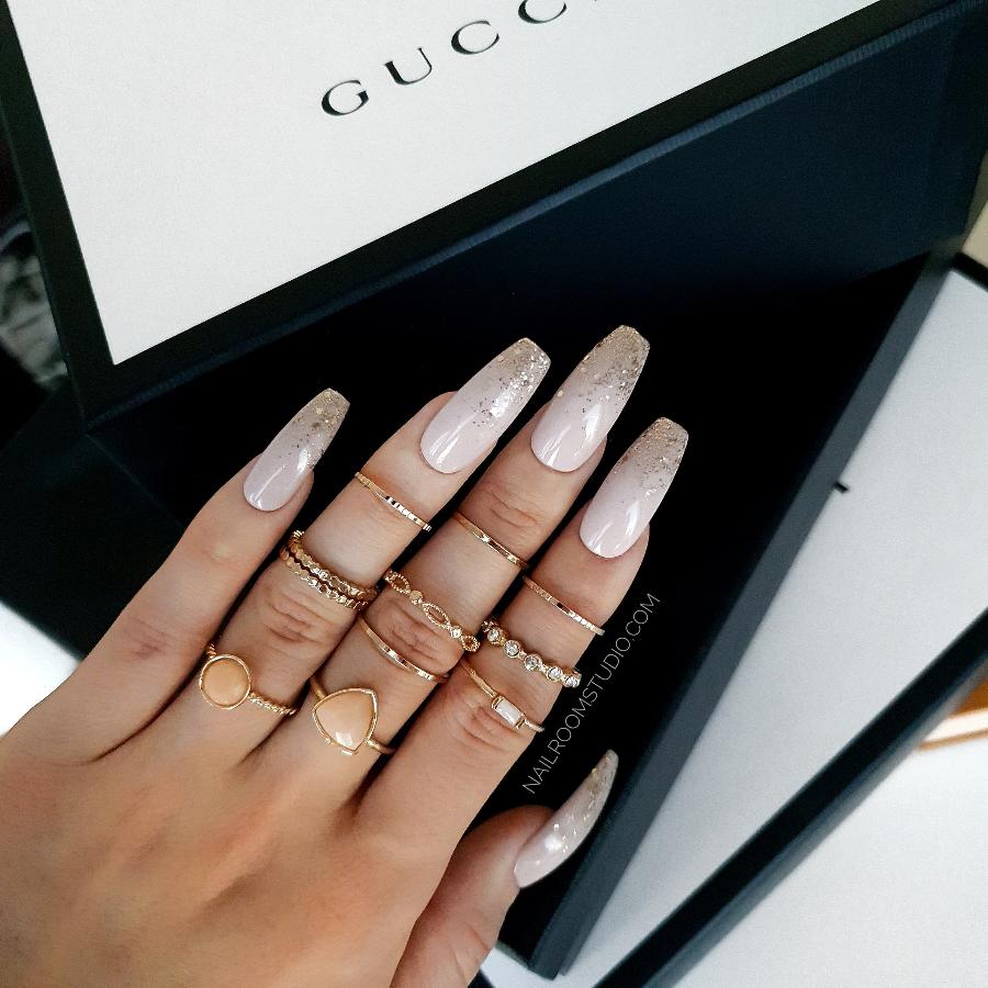 Nude coffin nails with a gold glitter ombre, ideal for weddings or a girly, soft look