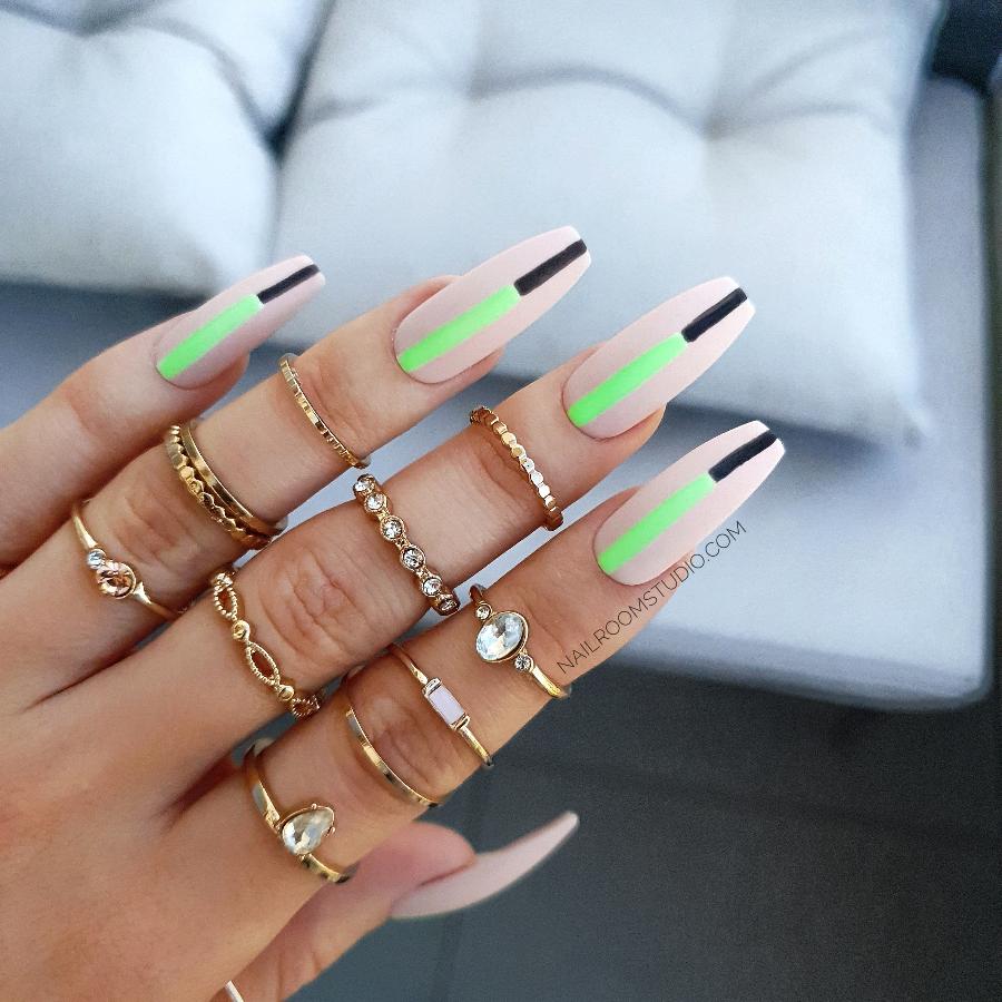 Classy nude nails with neon green and black lines, a fresh minimalist design for a modern style