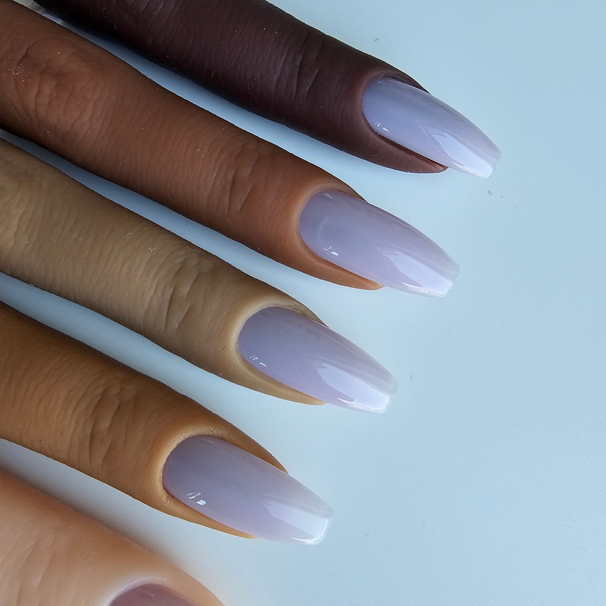 Light pigeon lilac press-on nails with a pastel undertone, a versatile and slightly blue shade with high coverage, every shade on skin, matching toes and fingers