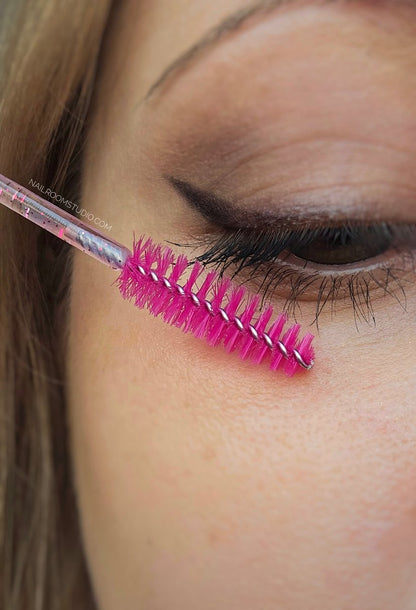 Pink glitter, partially transparent lash brush, perfect for detangling lash extensions, especially in the USA market