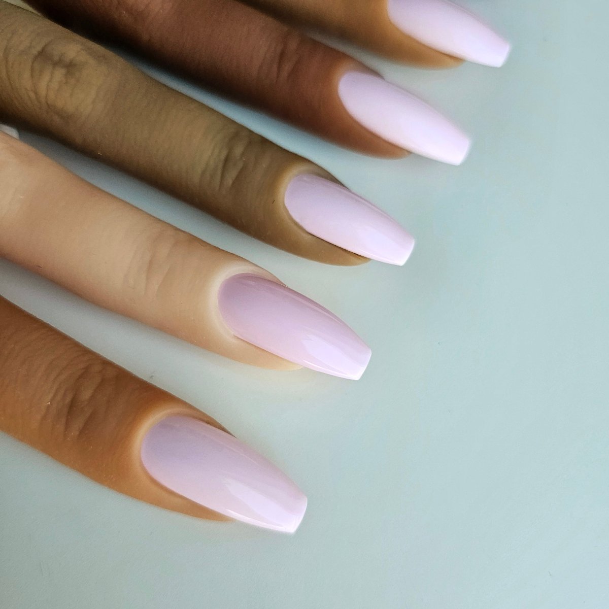 Elegant pink lilac nude PressOn nails with a soft pastel shade, perfect for a sophisticated and versatile look