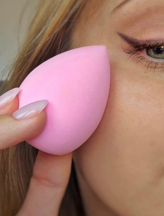 Soft pink beauty blender for seamless foundation application, designed to create a flawless finish for any makeup look