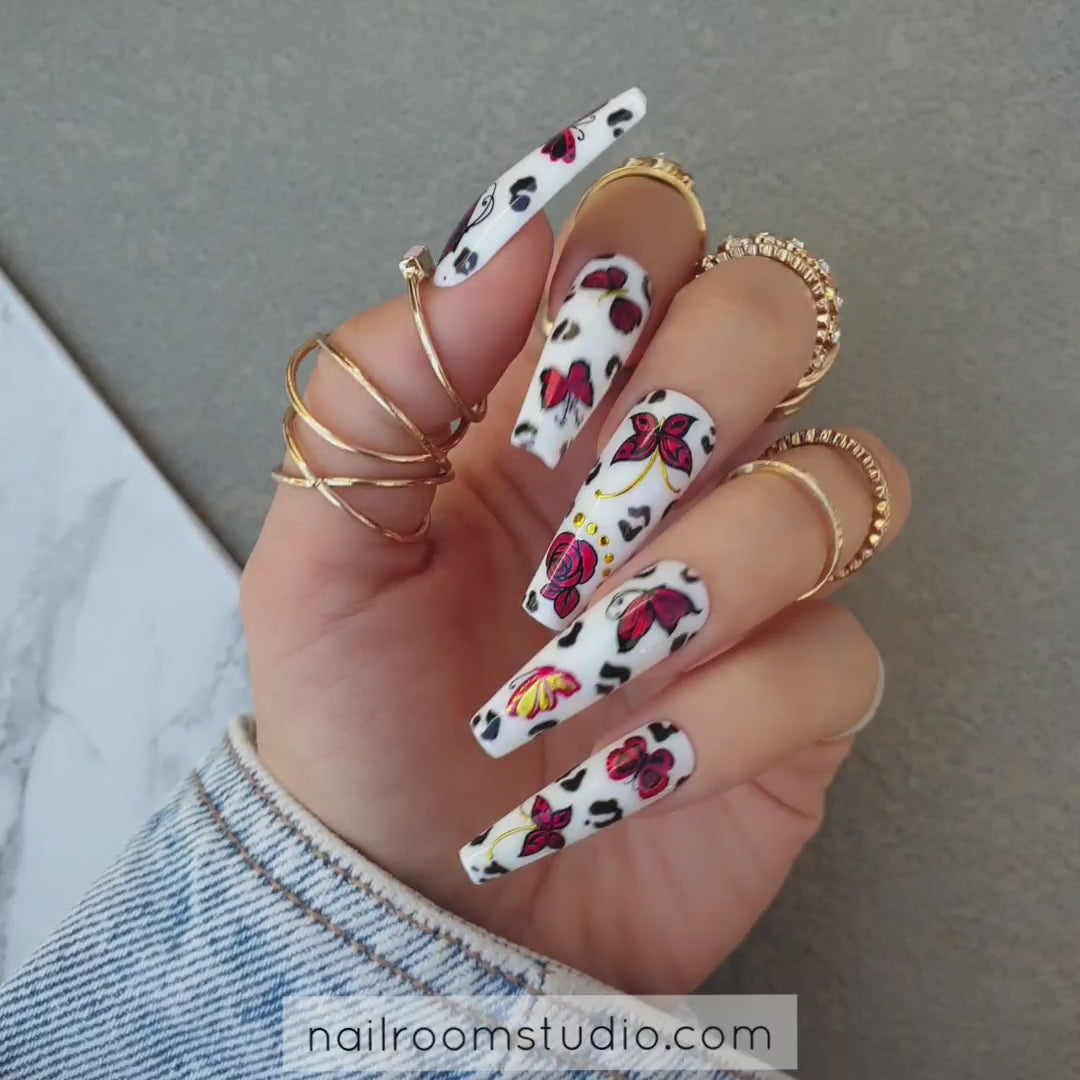 White nails with red floral and butterfly motifs, perfect for hands and toes, false nails set from Nail Room Studio in Hindi India