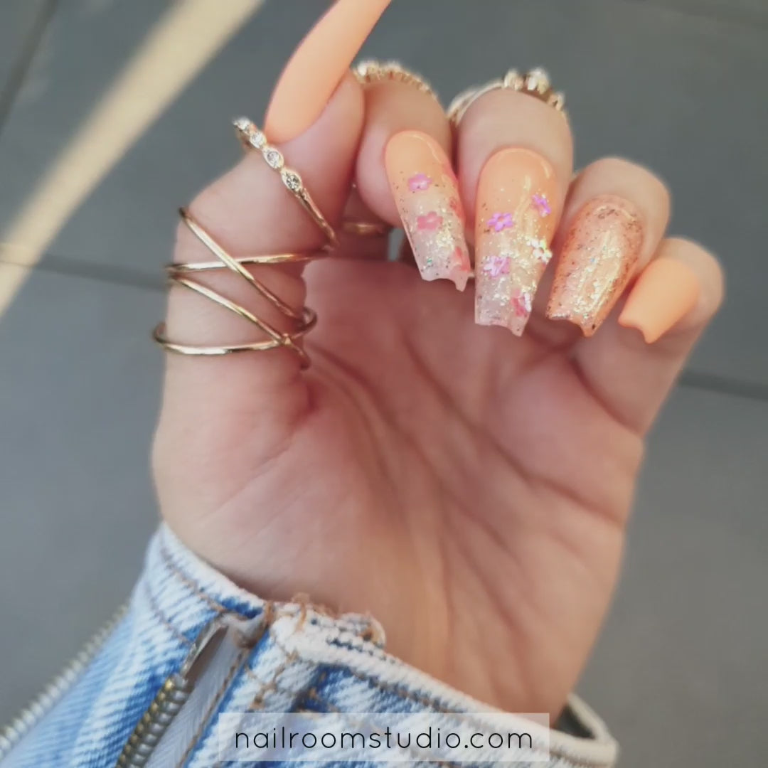 Juicy orange ombre coffin nails with matte and glossy chrome glitter, featuring a milky, transparent tip for a sunny summer look, with matching toes option by Nail Room Studio