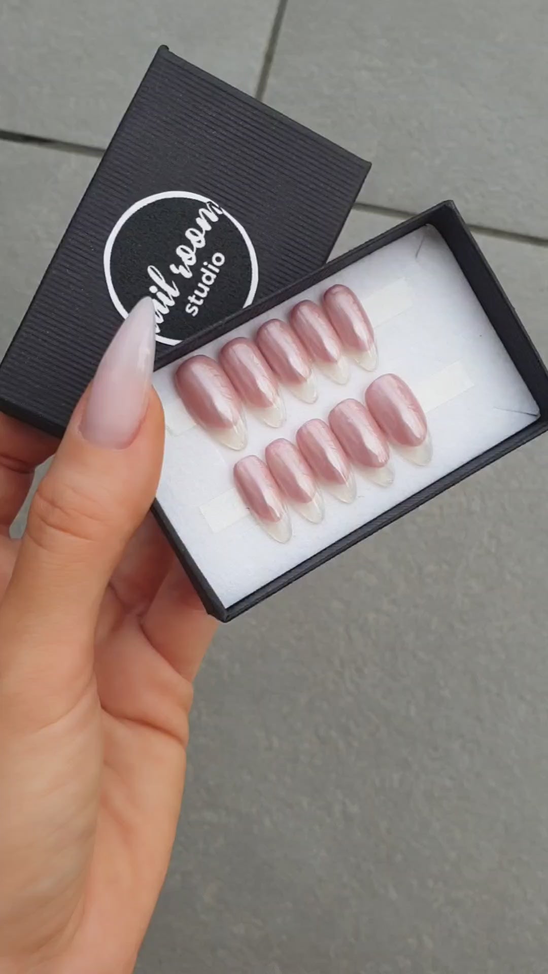 Glossy peach-beige-pink press-on nails featuring a French design with fancy transparent tips. Standard almond shape, available in various sizes with international delivery