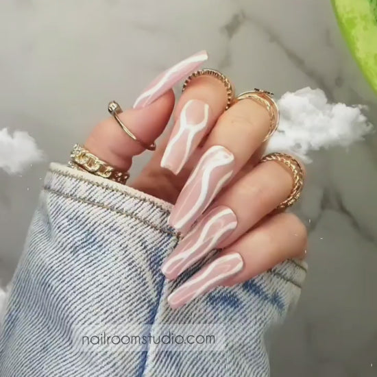 Personalized peach nude long coffin nails with elegant white waves design, ideal for pedicure and manicure, salon-quality press-on nails with glue from Nail Room Studio online shop