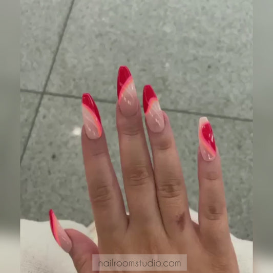 Nude and red press-on nails with irregular wave patterns and vibrant Coca-Cola red and orange geometric stripes, perfect for dark or brown skin tones, ideal for both hands and toes