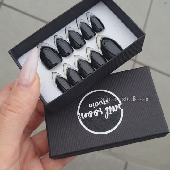 Stylish black press-on nails showcasing a chrome French style with a stunning silver finish. Standard stiletto length, expertly crafted for a luxurious appearance