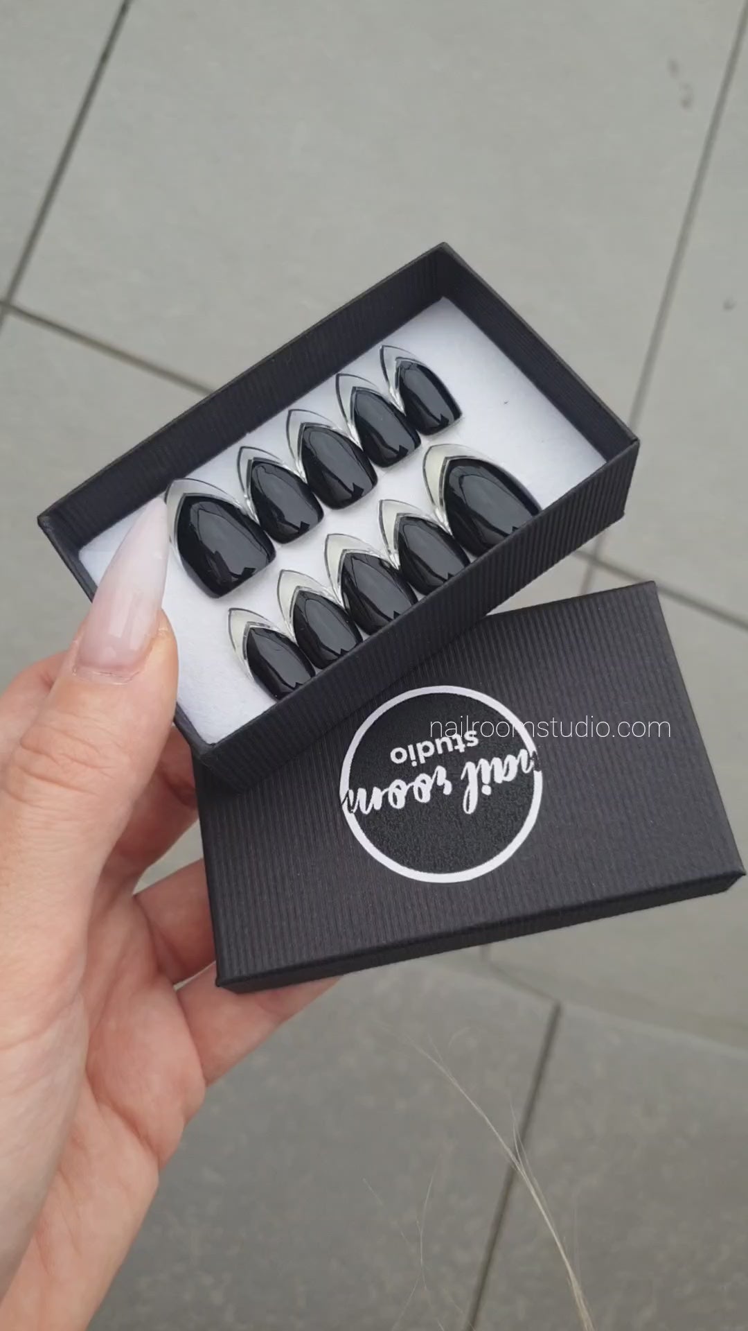 Stylish black press-on nails showcasing a chrome French style with a stunning silver finish. Standard stiletto length, expertly crafted for a luxurious appearance