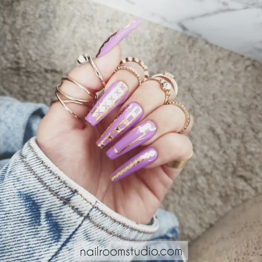 Purple lilac Extra Long Sculpted Coffin nails by Nail Room Studio with Real Gold Crown Nail Tattoos, available for both hands and toes fake tips