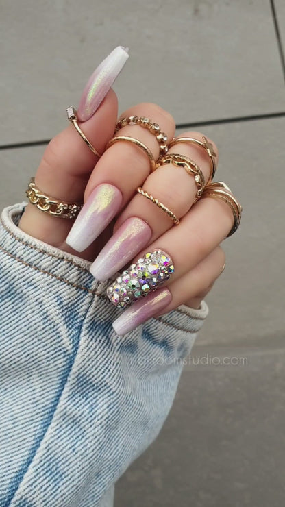 Shiny nude baby boomer ombre press-on nails with silver chrome accents, showcasing international shipping options