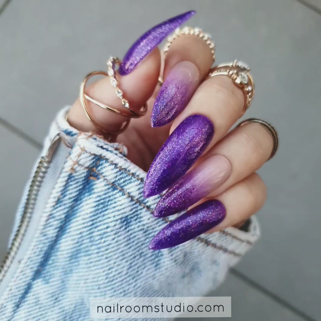 Long fileto nails in purple and violet ombre with nude accents and glitter detail, ideal for those with a witchy, mystical vibe, crafted by Nail Room Studio