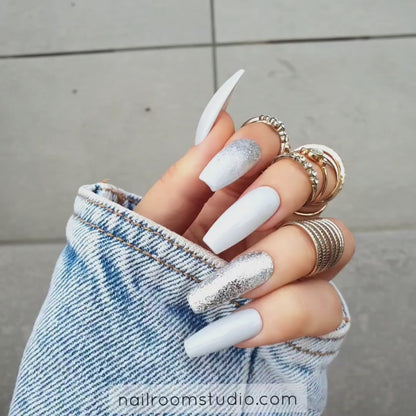 Dove grey nails with a classic design and silver chrome flakes, in long coffin shape, ideal for bridal looks by Nail Room Studio