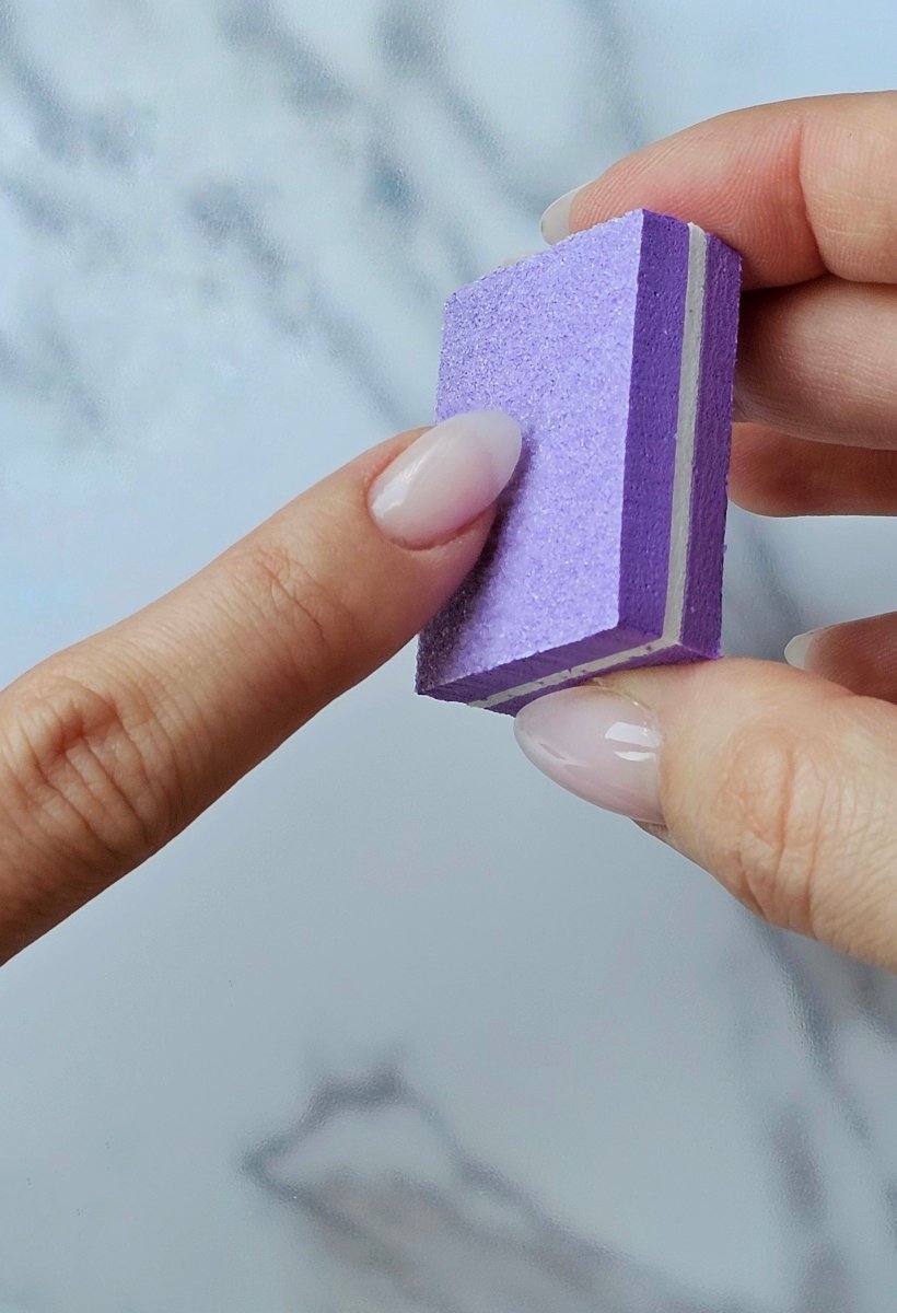 Purple double-sided nail buffer with various grits, perfect for prepping nails before applying Press-On Nails, you can use it for sensitive nails