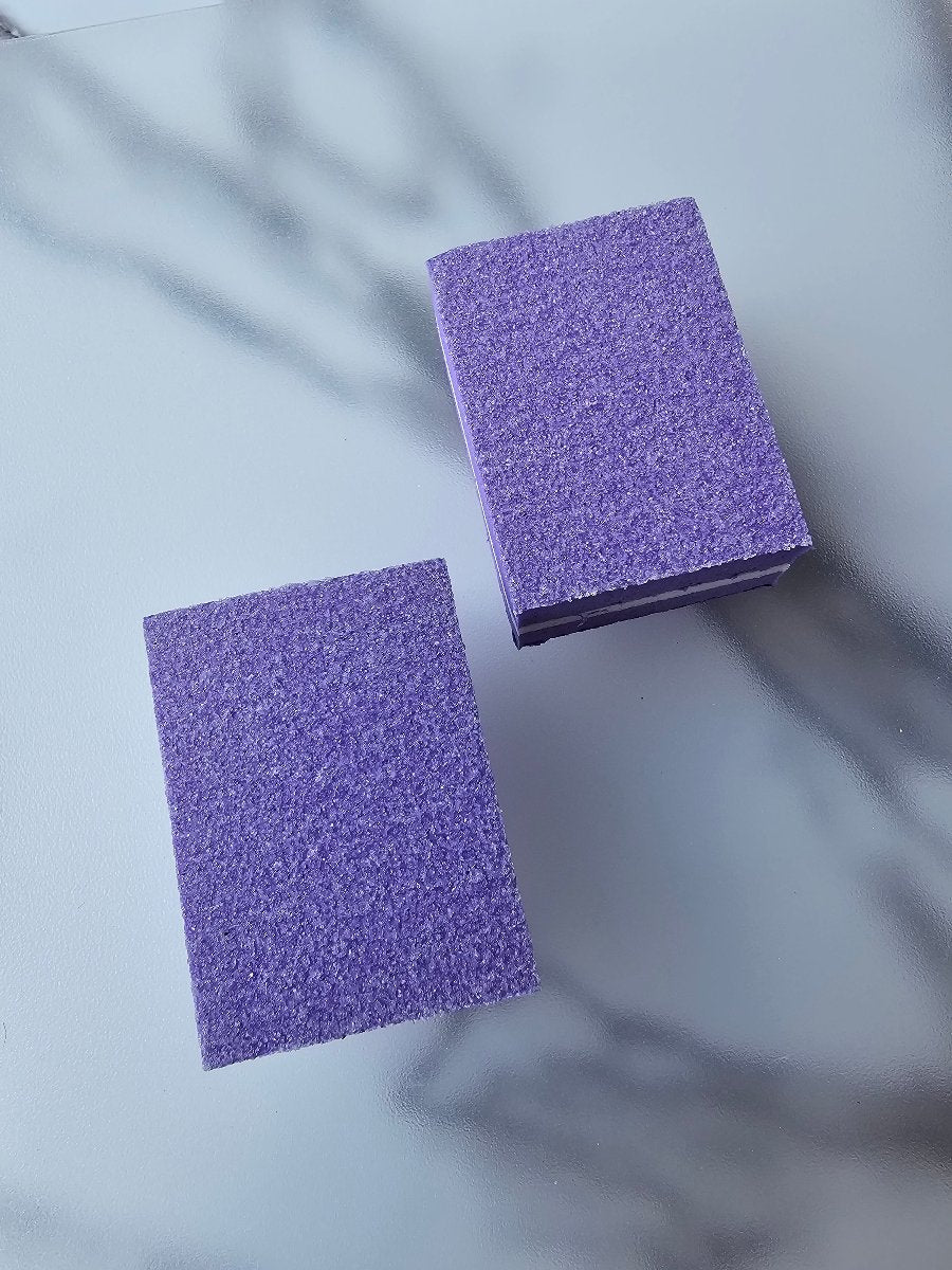 Purple double-sided nail buffer cubes, perfect for prepping nails for Press-On Nail applications