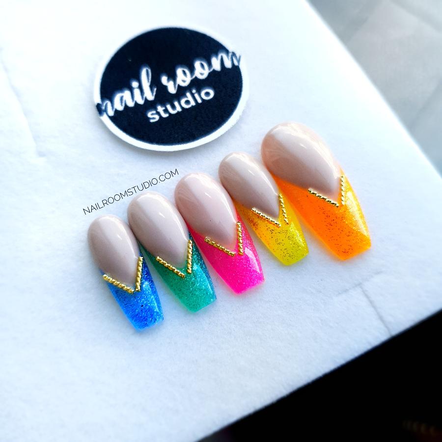 Nude nails with 3D metallic accents and rainbow-colored, jelly French tips for a unique summer style