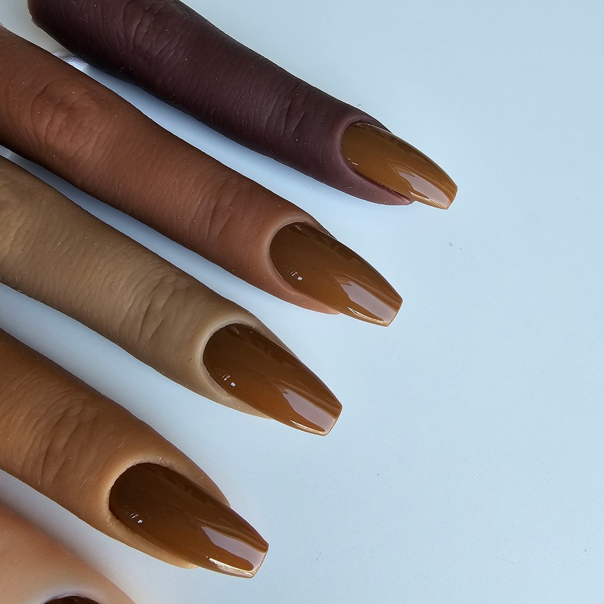 Soft brown-beige artificial nails with high opacity, blending subtle pastel tones with intense caramel coverage, all skin tones