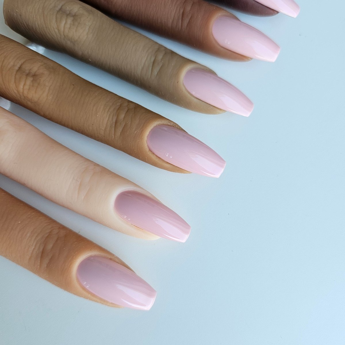 Light pastel pink PressOn nails, artificial nails with a soft finish - feminine, ideal for enhancing light to medium skin tones from Nail Room Studio online press on shop with international fast shipping