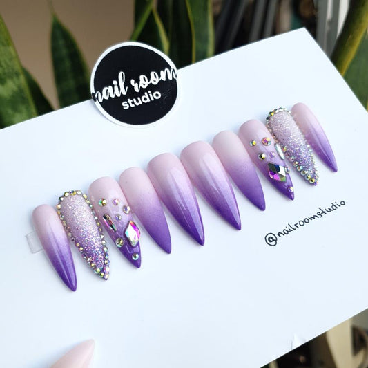 Gorgeous ombre press on nails in purple and lilac shades with crystal accents, offered in various sizes for a personalized style