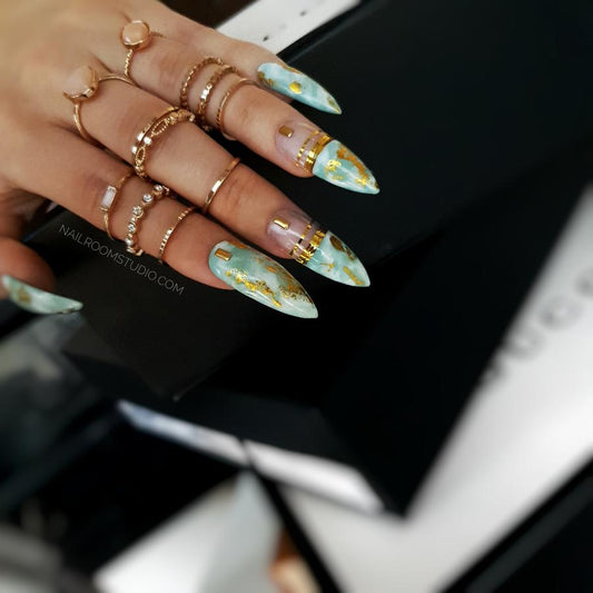 Refreshing mint and baby blue nails featuring golden chrome accents, capturing a tropical and exotic aesthetic