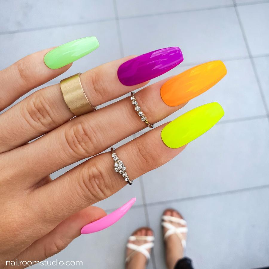 Summer-ready long coffin press-on nails in bright neon colors like green, purple, orange, yellow, and pink. Available for online purchase with international shipping options