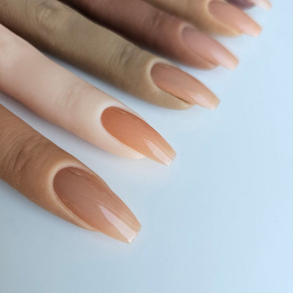 Warm-toned beige PressOn nails with a partially transparent finish, designed to enhance French manicures