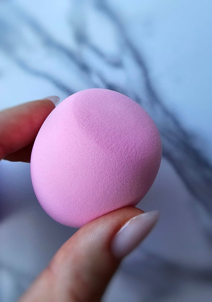 Water-activated pink beauty blender for enhanced makeup application, ideal for achieving a natural look with your favorite products